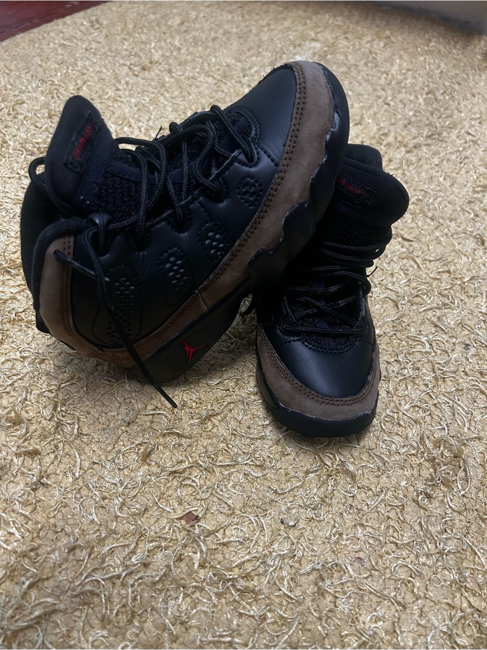 Jordan 9’s. Black , red , brownish green.